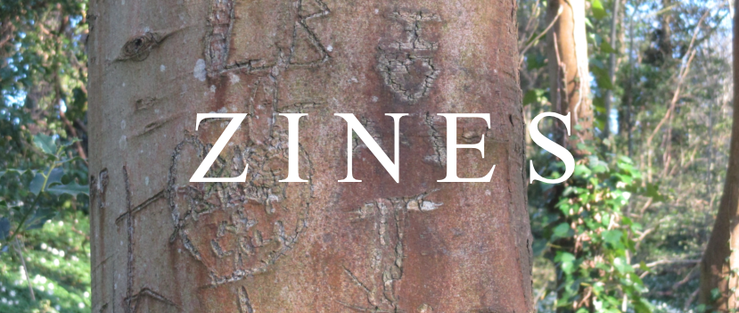 photo of a tree trunk with carved initials in it. there's white text over top saying ZINES